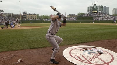 In this June 6, 2003, file photo, the New York Yankees' Derek Jeter warms up in the on-deck circle in a baseball game against the Chicago Cubs at Wrigley Field in Chicago. M Spencer Green / AP