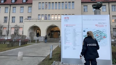 A police officer looks at a clinic map of the Klinikum Schwabing, after Germany has declared its first confirmed case of the deadly coronavirus that broke out in China, in Munich, Germany. Reuters