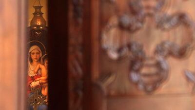 A priest is pictured at the Saint Sarkis Armenian Cathedral in the Iranian capital Tehran, during a mass celebrating the Armenian Christmas. AFP