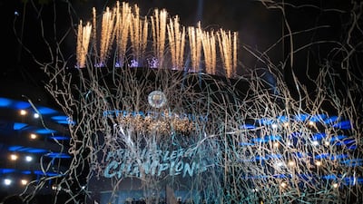 Manchester City's players and coaching staff present the Premier League trophy to supporters outside the Etihad Stadium in Manchester, northern England on May 12, 2019. Manchester City held off a titanic challenge from Liverpool to become the first side in a decade to retain the Premier League on Sunday by coming from behind to beat Brighton 4-1 on Sunday. / AFP / OLI SCARFF