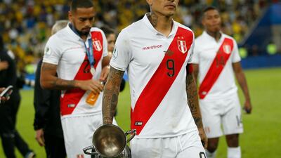 Peru's players reflect on their loss. AP Photo
