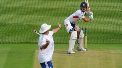 Alastair Cook takes batting practice with coach Graham Gooch. The England captain’s run production has been down.