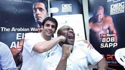 Eisa Aldah, left, and Bob Sapp play up to the cameras at the press conference in Dubai.