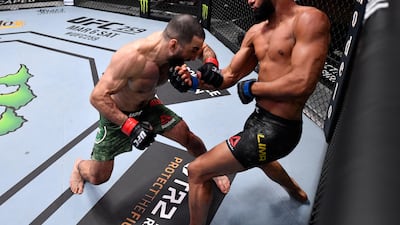 Dhiego Lima, right, of Brazil punches Belal Muhammad in their welterweight fight during the UFC 258 event at UFC APEX in Las Vegas, Nevada. Jeff Bottari / Zuffa LLC / UFC