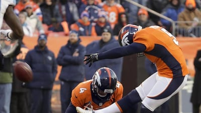 Denver's Matt Prater, right, kicked a NFL record 64-yard field goal this season. Jack Dempsey / AP Photo