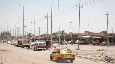 A car drives along a street of Basra in southern Iraq. Photo by Sebastian Castelier