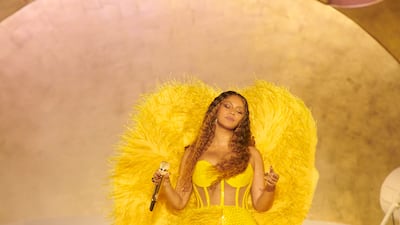 Another of her costumes was a yellow feathered dress by Atelier Zuhra. Photo by Mason Poole/Parkwood Media/Getty Images for Atlantis The Royal