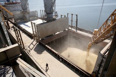 A dockyard worker watches as barley grain is mechanically poured into a 40,000 tonne ship in Nikolaev, Ukraine. Since the start of the war, weekly port calls have gone from 60 to almost zero in Ukraine. Reuters/ File