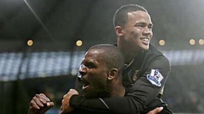 Darren Bent celebrates scoring the first of his two goals with Jermaine Jenas in Totteham's 2-1 win against Manchester City.