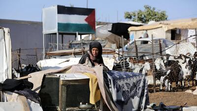 A Palestinian woman reacts after Israeli troops demolished her shed among other five sheds in the West Bank village of Um Alkhair. Abed Al Hashlamoun / EPA