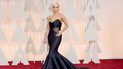 Rita Ora’s navy, super-long fishtail dress failed on many levels; from the highly contoured face and platinum blonde hair to the tight on the hips, loose on the torso fit of the dress. Jason Merritt / Getty Images / AFP