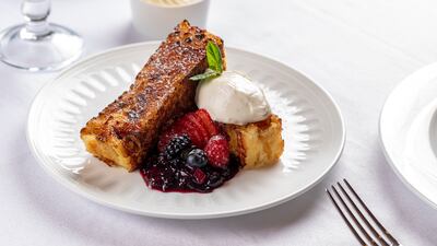 French toast with vanilla egg cream, berries and Chantilly cream.