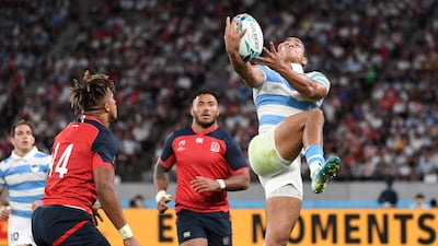 Argentina's wing Santiago Carreras intercepts the ball during the Pool C against England. AFP
