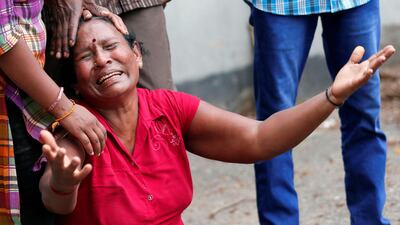 A relative of a victim of the explosion at St. Anthony's Shrine, Kochchikade church, reacts at the police mortuary in Colombo, Sri Lanka April 21, 2019. REUTERS/Dinuka Liyanawatte