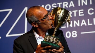 Kamel El Basha kisses the Volpi Cup for best actor for his role in The Insult during the awards photo call at the 74th Venice Film Festival. Domenico Stinellis / AP photo