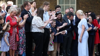 Mr Burnham greets supporters as he arrives at No 10 Downing Street. Reuters