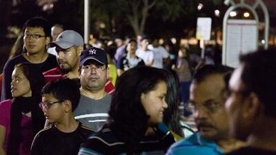Entrants wait at Al Barsha Pond Park to register for the weight-loss contest but the weigh-in was hit by problems. Duncan Chard for the National