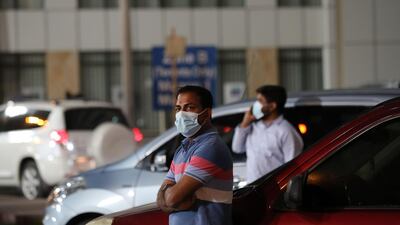 Cricket fans wait outside Sharjah Cricket Stadium during an IPL match. Supporters are banned from attending matches due to Covid-19 concerns.