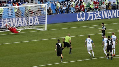 Iceland goalkeeper Hannes Halldorsson saves a penalty by Argentina's Lionel Messi. Rebecca Blackwell / AP Photo
