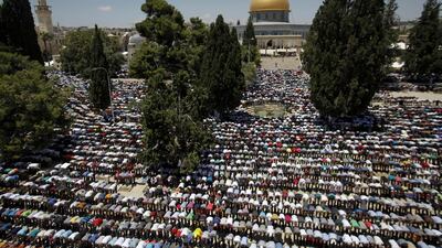 Palestinian worshippers pray in front of the Al Aqsa Mosque in Jerusalem during the first Friday of the holy month of Ramadan. AP