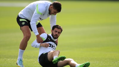 Ruben Dias, left, and Bernardo Silva. AFP