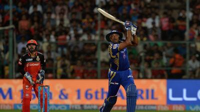 Kieron Pollard hits one of his five sixes during a 47-ball 70 that led Mumbai Indians to victory over Royal Challengers Bangalore. Manjunath Kiran / AFP