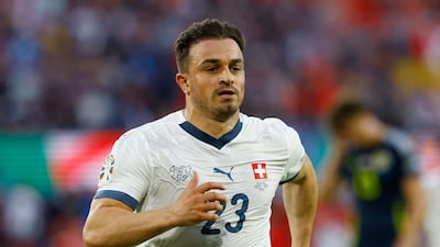 Switzerland's Xherdan Shaqiri celebrates scoring the equaliser against Scotland. Reuters