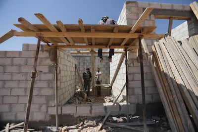Jaish Al Islam members are seen at a construction site in the town of Soussian in Aleppo countryside. Reuters