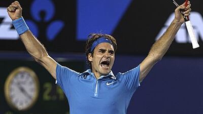 Roger Federer celebrates a remarkable 16th grand slam title yesterday.