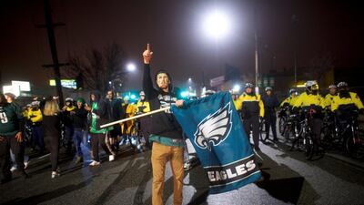 Tom Roush waves a flag while celebrating the Philadelphia Eagles Superbowl LII victory over the New England Patriots. REUTERS/Mark Makela