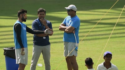 India’s Virat Kohli speaks with coach Anil Kumble and selector Jatin Paranjpe . Punit Paranjpe / AFP