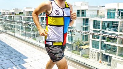 Collin practises on his balcony ahead of Saturday morning's marathon. He'll have to complete 2,200 full lengths of the Meydan apartment to hit 42.2km. Courtesy: Collin Allin