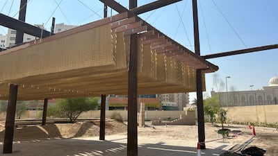 Al Borde's Raw Threshold, an installation that utilises recycled wooden utility poles and palm tree mats