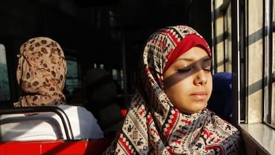 Leila Abdel Basset, 24, rides the metro to work in an all-female car, in Cairo, Egypt.