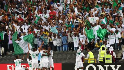Nigerian players celebrate after winning the FIFA U-17 World Cup 2013 at Mohammed bin Zayed Stadium, on November 8, 2013 in Abu Dhabi, UAE. Nigeria won the final against Mexico 3-0. AFP PHOTO MARWAN NAAMANI