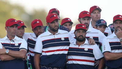 Captain Keegan Bradley and members of Team United States stand together on the 18th green after being defeated by Team Europe. AFP