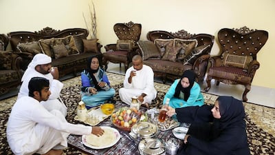 A family sitting in the majlis area at their home in Dubai. Pawan Singh / The National