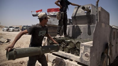 Iraqi counterterrorism forces load a Humvee with rockets to take to a front line position in their fight to oust ISIL militants from Fallujah, Iraq on June 7, 2016. Maya Alleruzzo/AP Photo