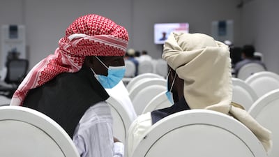 People with expired resident or tourist visas seek information at the Al Aweer amnesty centre in Dubai
