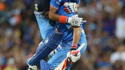 Suresh Raina, on top, celebrates with Yuvraj Singh of India after hitting a four last ball to win the third Twenty20 international cricket match against Australia in Sydney on January 31, 2016. AFP PHOTO / CRAIG GOLDING