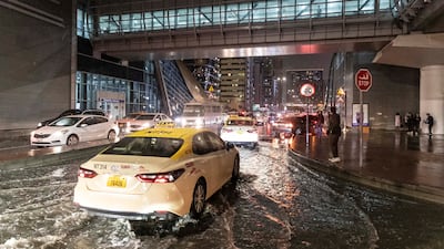 Cars drive through the rain in Dubai. Antonie Robertson / The National