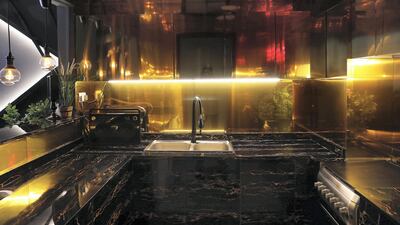 DUBAI , UNITED ARAB EMIRATES , December 15 – 2018 :- View of the kitchen at the apartment of Areeb Hassan in International City in Dubai. ( Pawan Singh / The National ) For Luxury and Lifestyle. Story by Melanie Hunt