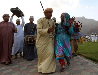An Omani couple in national dress perform a traditional dance at the end of the second stage of the Tour of Oman at Wadi Dayqah in February, 2012. AFP