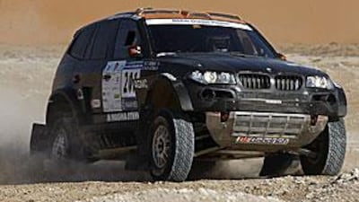Nasser Al Attiyah and Tina Thorner reach a checkpoint in the Empty Quarter during the UAE Desert Challenge last year.