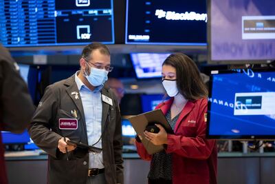 Stocks on Wall Street were trading lower and the dollar rose against a basket of currencies as US Treasury prices fell. New York Stock Exchange via AP)