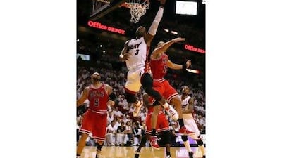 Dwyane Wade was at his best in overtime. 'This is his time,' Erik Spoelstra, his coach, said.