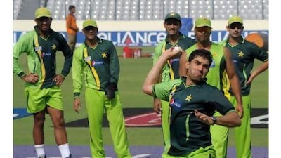 Pakistani cricketer Misbah ul Haq throws a ball during a training session in Dhaka. A reader speculates on what would happen if Pakistan win the Cricket World Cup on Indian soil. Deshakalyan Chowdhury / AFP