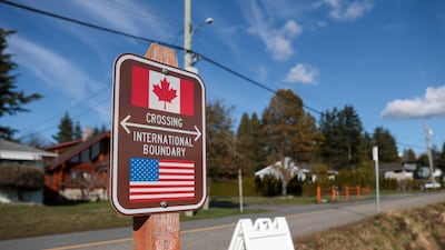 A sign marking the US-Canada border at Peace Arch Historical State Park in Blaine, Washington state. AFP