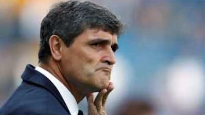 Tottenham manager Juande Ramos watches his team warm up before their match.