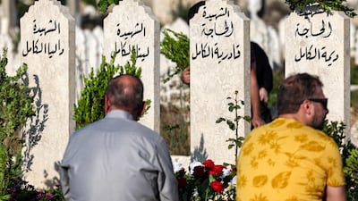 People visit the graves of loved ones on the first day of Eid Al Adha in Syria's rebel-held north-western city of Idlib. AFP